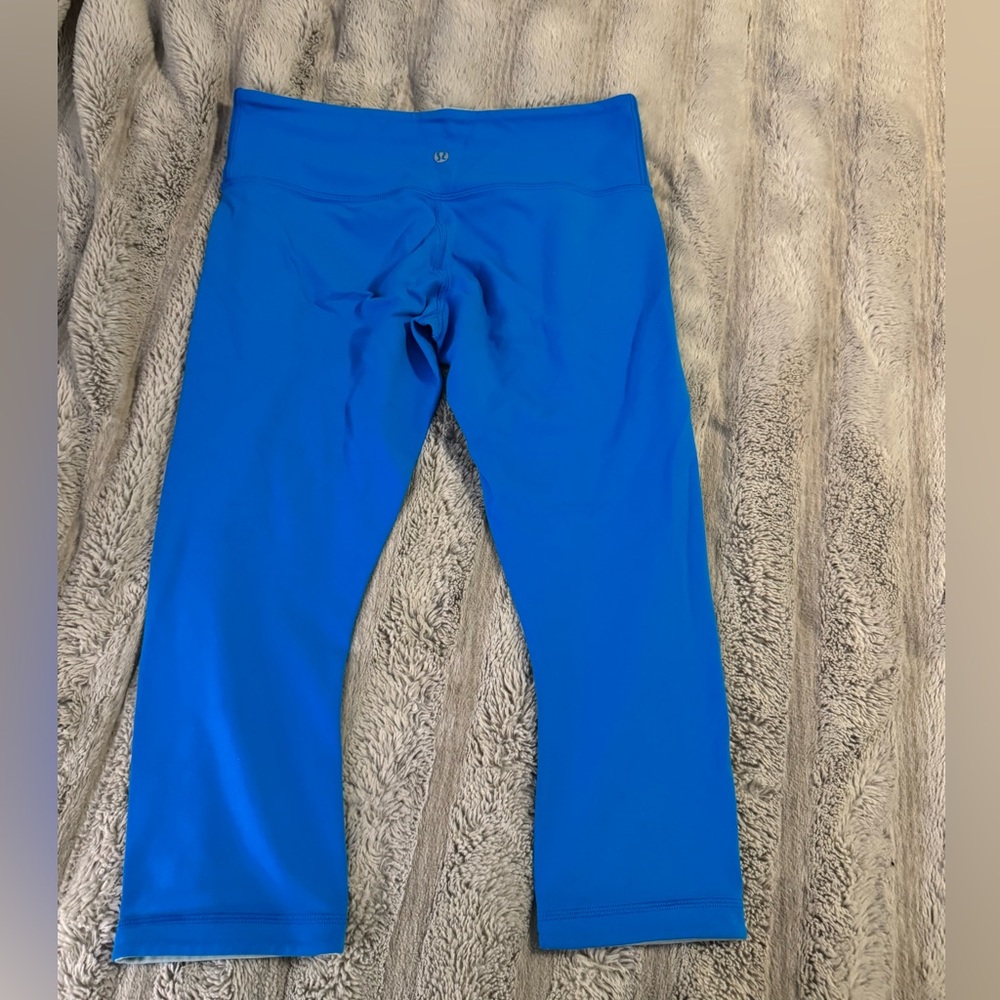 Tropical blue reversible Lululemon leggings size 8. GUC! Offers welcome